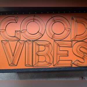 Gold metal wall sign